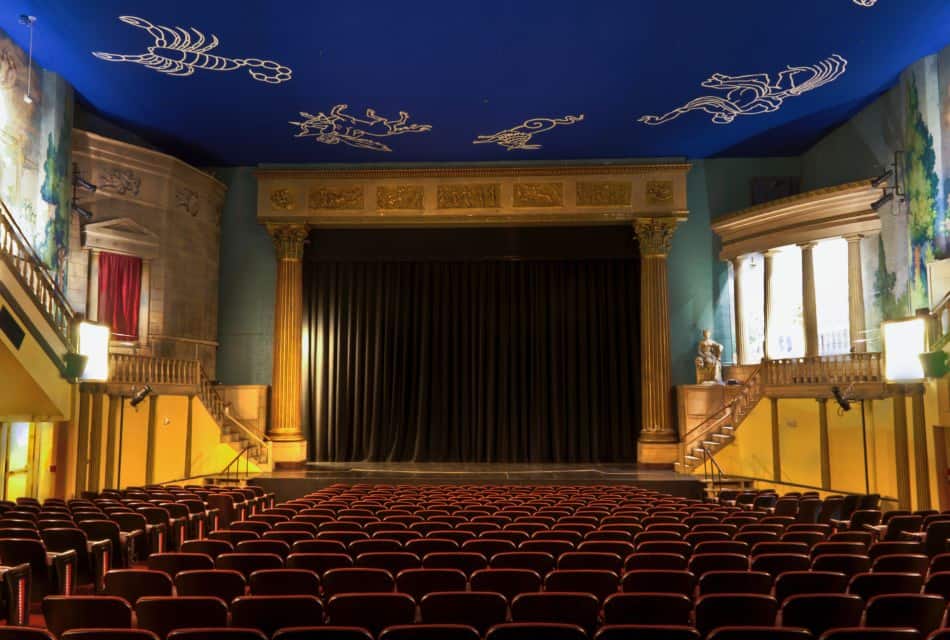 Inside of old theater with ornate decorations