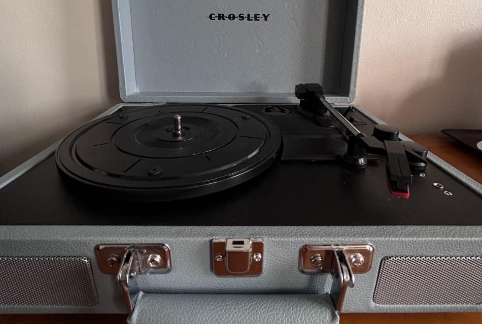 Close up view of record player in gray leather case