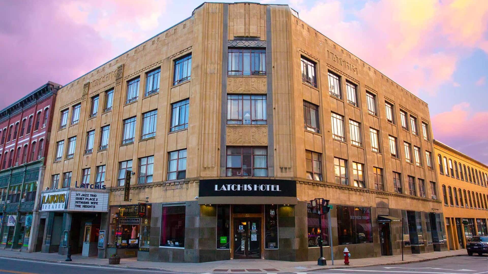 Exterior view of property which is an historic looking building on the corner of a downtown street