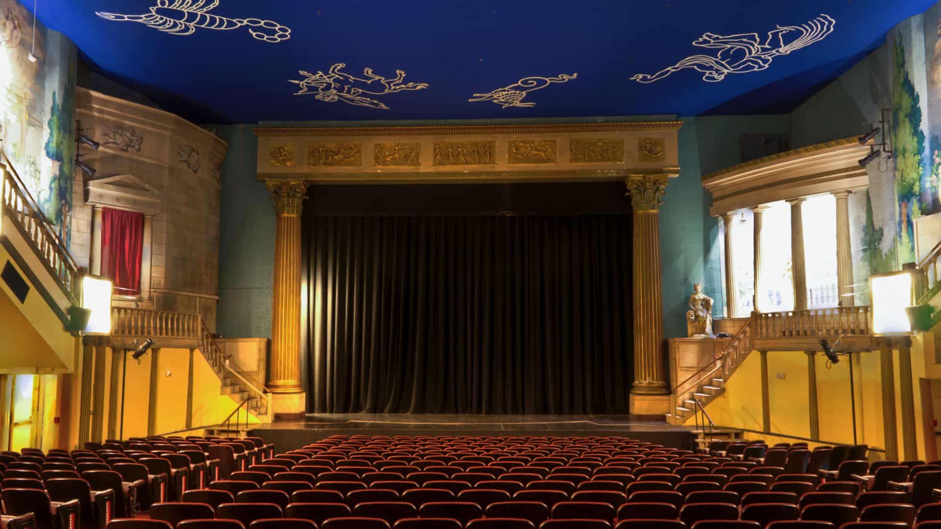 Inside of old theater with ornate decorations