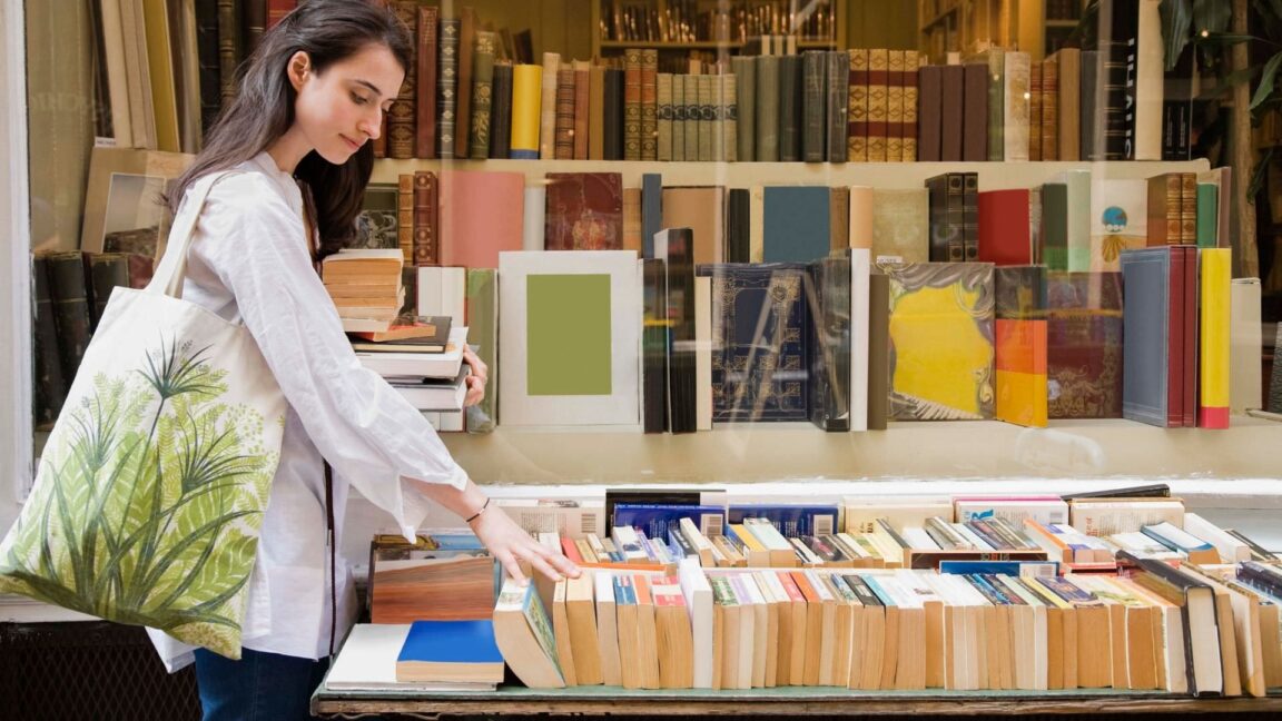 a woman is shopping at a bookstore